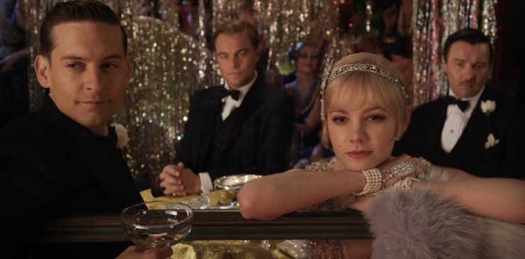 Image of Nick (Tobey Maguire), Gatsby (Leonardo DiCaprio), Daisy (Carey Mulligan), and Tom (Joel Edgerton) in the 2013 film The Great Gatsby