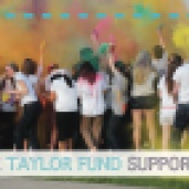 Front of Taylor Fund mailer, with picture of students throwing colored powder. Text reads, "100% of the Taylor Fund supports students."